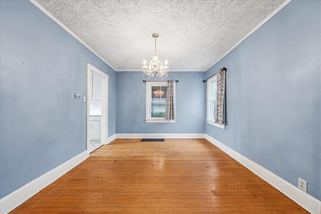 412 Cumberland St E, Cowan, TN 37318 - spare room featuring a chandelier, crown molding, hardwood / wood-style floors, and a textured ceiling