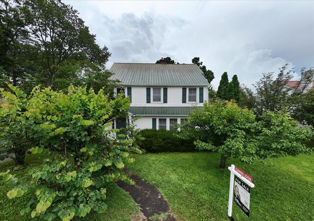 412 Cumberland St E, Cowan, TN 37318 - view of front of house featuring a metal roof and a front yard