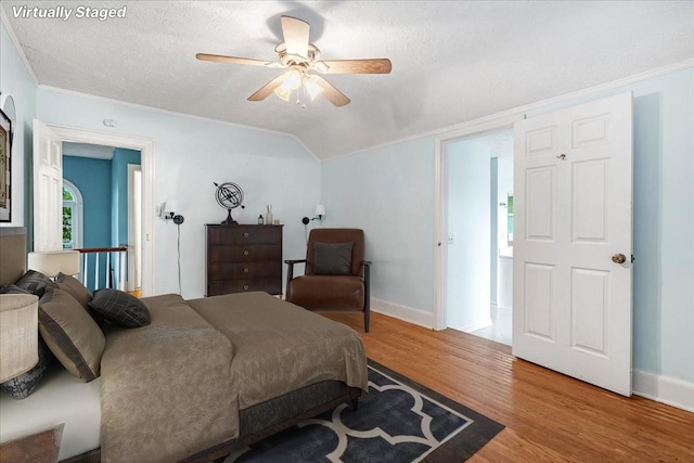 412 Cumberland St E, Cowan, TN 37318 - bedroom featuring wood finished floors, a textured ceiling, ceiling fan, and lofted ceiling