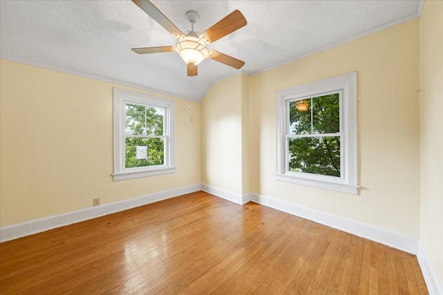 412 Cumberland St E, Cowan, TN 37318 - unfurnished room with light wood finished floors, a textured ceiling, ornamental molding, a ceiling fan, and vaulted ceiling