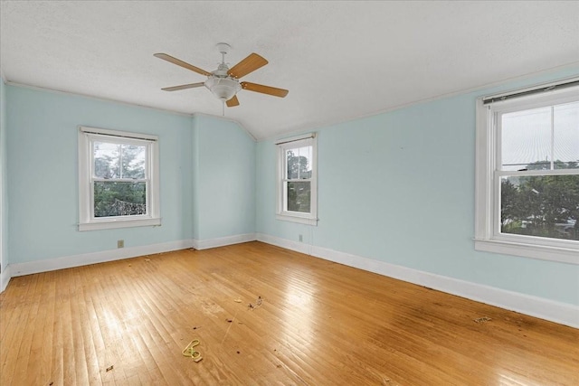 412 Cumberland St E, Cowan, TN 37318 - empty room featuring hardwood / wood-style flooring, plenty of natural light, vaulted ceiling, and a ceiling fan