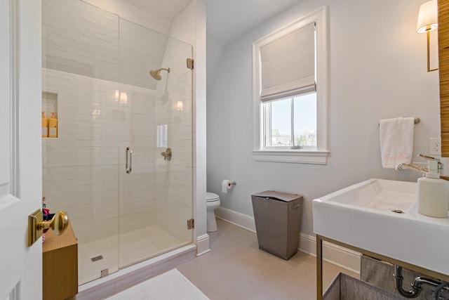 7212 Shagbark Ln, College Grove, TN 37046 - full bath with baseboards, a stall shower, toilet, tile patterned floors, and a sink