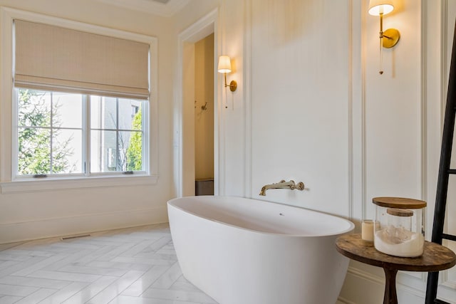 7212 Shagbark Ln, College Grove, TN 37046 - bathroom featuring a freestanding tub and baseboards