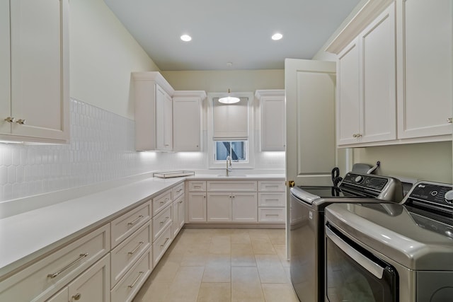 7212 Shagbark Ln, College Grove, TN 37046 - laundry area featuring independent washer and dryer, a sink, light tile patterned floors, and recessed lighting