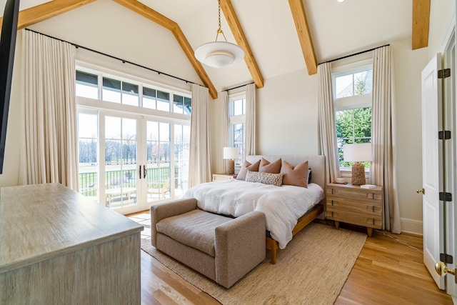 7212 Shagbark Ln, College Grove, TN 37046 - bedroom with access to outside, beam ceiling, light wood-style floors, high vaulted ceiling, and baseboards