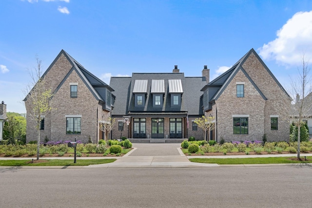7212 Shagbark Ln, College Grove, TN 37046 - view of front facade featuring brick siding, a chimney, and french doors