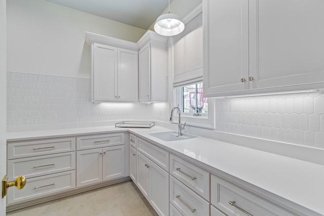 7212 Shagbark Ln, College Grove, TN 37046 - kitchen with a sink, light countertops, white cabinetry, tasteful backsplash, and light tile patterned floors