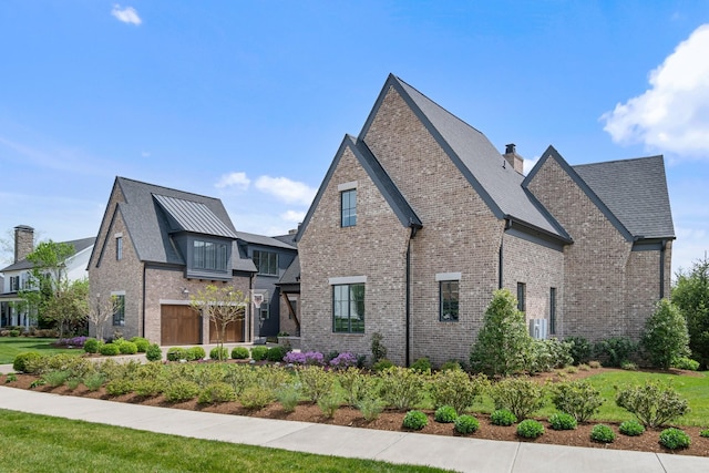 7212 Shagbark Ln, College Grove, TN 37046 - view of home's exterior featuring brick siding and a chimney