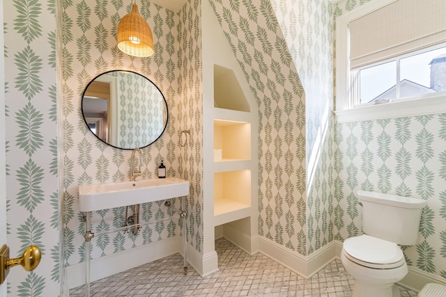 7212 Shagbark Ln, College Grove, TN 37046 - bathroom with wallpapered walls, baseboards, toilet, and a sink