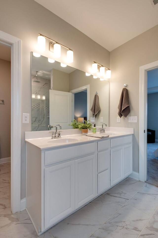 1207 Bridgett Way, Mount Juliet, TN 37122 - bathroom with marble look tile flooring, double vanity, a marble finish shower, and baseboards