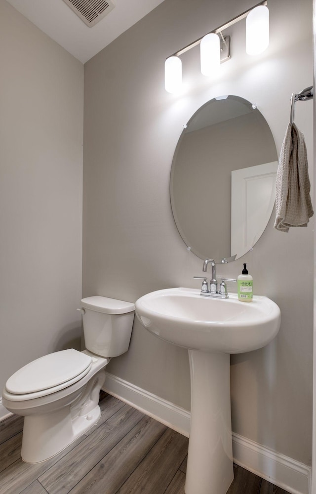 1207 Bridgett Way, Mount Juliet, TN 37122 - bathroom with wood finished floors, toilet, baseboards, and a sink