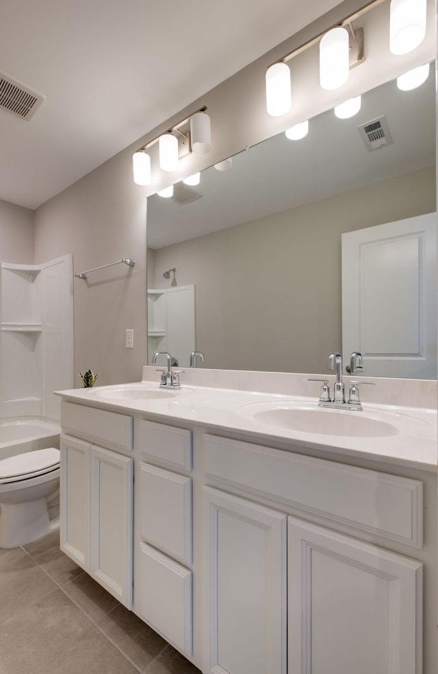 1207 Bridgett Way, Mount Juliet, TN 37122 - full bathroom with double vanity, toilet, tile patterned floors, and shower / bathtub combination