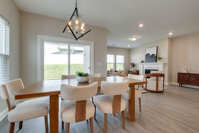 1207 Bridgett Way, Mount Juliet, TN 37122 - dining room with a chandelier, a fireplace, light wood finished floors, baseboards, and recessed lighting