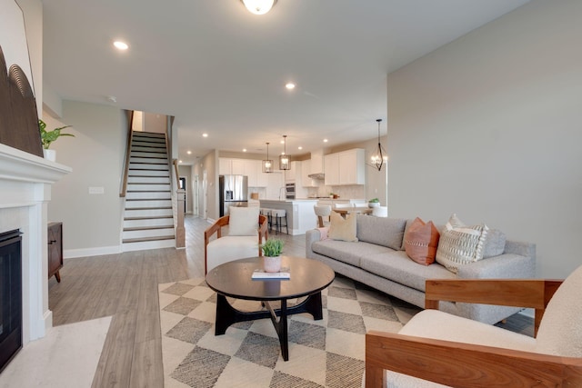 1207 Bridgett Way, Mount Juliet, TN 37122 - living area featuring recessed lighting, a high end fireplace, light wood-type flooring, stairs, and baseboards