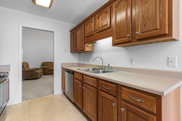 2707 Comer Dr, Murfreesboro, TN 37128 - kitchen featuring stainless steel appliances, a sink, light colored carpet, light countertops, and brown cabinets