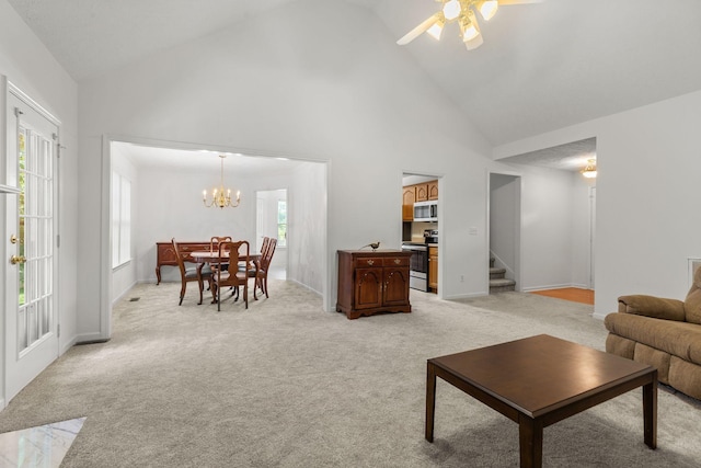 2707 Comer Dr, Murfreesboro, TN 37128 - living area with high vaulted ceiling, stairway, light colored carpet, ceiling fan, and a chandelier