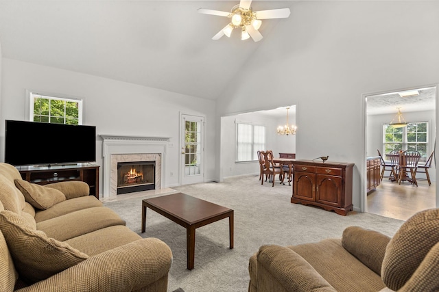 2707 Comer Dr, Murfreesboro, TN 37128 - living room featuring high vaulted ceiling, a ceiling fan, a premium fireplace, a chandelier, and light carpet