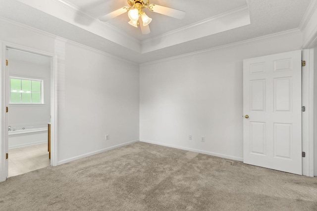 2707 Comer Dr, Murfreesboro, TN 37128 - carpeted empty room featuring a tray ceiling, a ceiling fan, crown molding, and baseboards