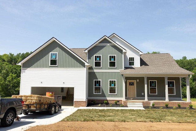 5590 Chambers Rd, Cumberland Furnace, TN 37051 - view of front of house with board and batten siding, concrete driveway, a porch, roof with shingles, and an attached garage