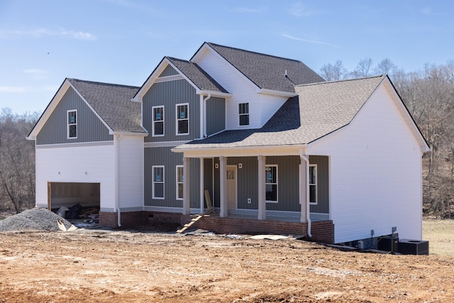 5590 Chambers Rd, Cumberland Furnace, TN 37051 - modern farmhouse with covered porch, roof with shingles, a garage, and central AC unit