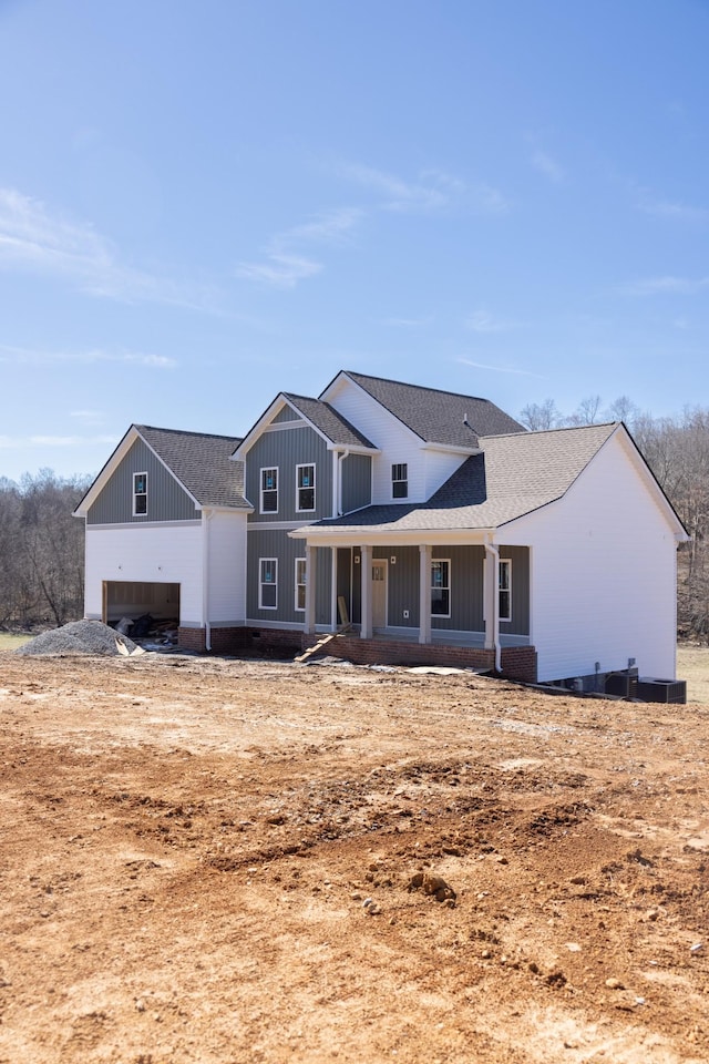 5590 Chambers Rd, Cumberland Furnace, TN 37051 - modern inspired farmhouse with a shingled roof, board and batten siding, and covered porch