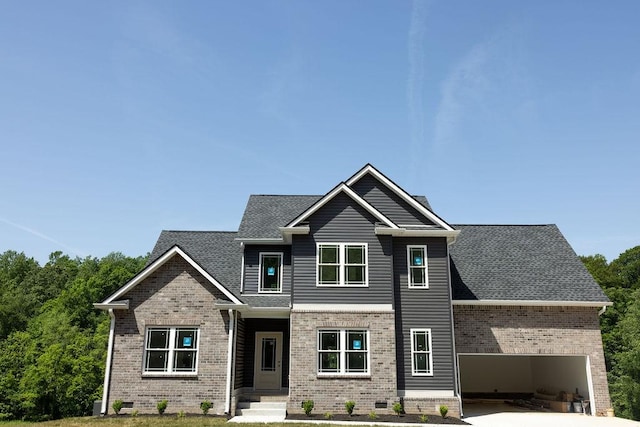 5580 Chambers Rd, Cumberland Furnace, TN 37051 - view of front of house featuring an attached garage, brick siding, concrete driveway, and roof with shingles