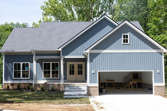 5570 Chambers Rd, Cumberland Furnace, TN 37051 - view of front facade featuring a porch, driveway, roof with shingles, french doors, and a garage