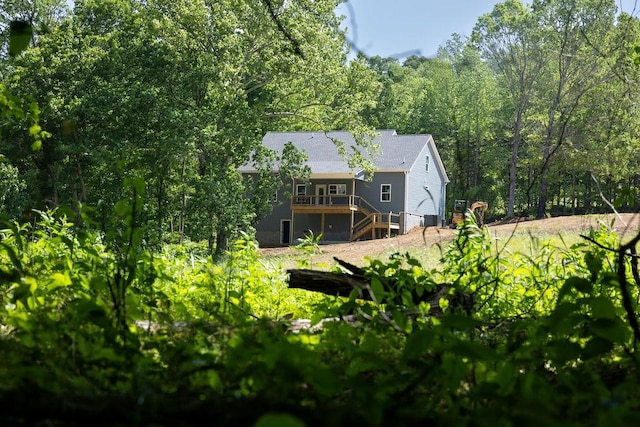 5570 Chambers Rd, Cumberland Furnace, TN 37051 - back of house with a wooden deck, stairway, and a forest view