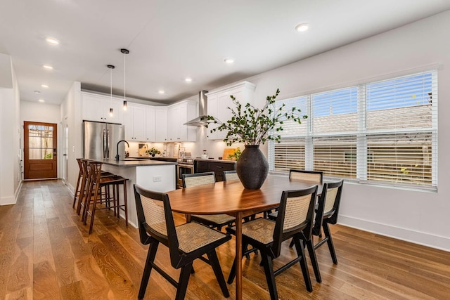 600B 41st Ave N, Nashville, TN 37209 - dining area featuring baseboards, wood finished floors, and recessed lighting