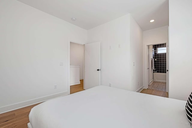 606A 41st Ave N, Nashville, TN 37209 - bedroom featuring wood finished floors, baseboards, and recessed lighting