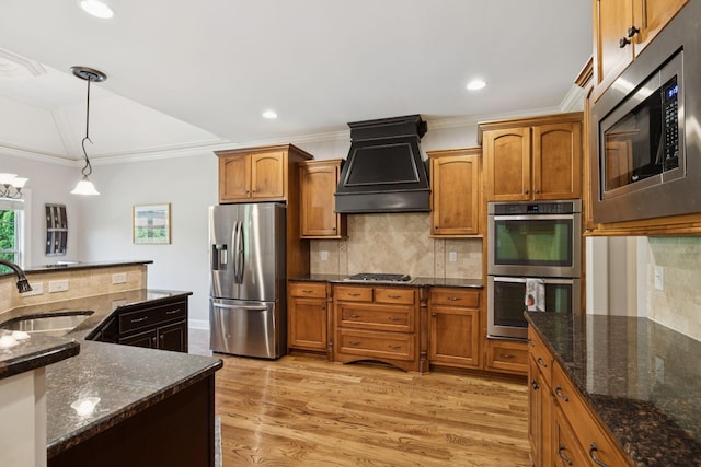 4181 Miles Johnson Pkwy, Spring Hill, TN 37174 - kitchen featuring stainless steel appliances, a sink, custom exhaust hood, backsplash, and crown molding