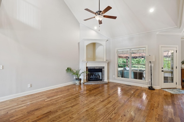 4181 Miles Johnson Pkwy, Spring Hill, TN 37174 - unfurnished living room featuring a ceiling fan, a stone fireplace, high vaulted ceiling, wood finished floors, and baseboards