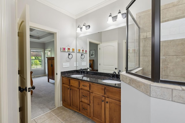 4181 Miles Johnson Pkwy, Spring Hill, TN 37174 - bathroom featuring crown molding, double vanity, tile patterned flooring, and baseboards