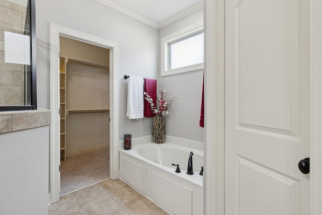 4181 Miles Johnson Pkwy, Spring Hill, TN 37174 - full bath featuring a jetted tub, crown molding, a walk in closet, and tile patterned floors