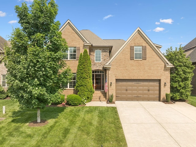 4181 Miles Johnson Pkwy, Spring Hill, TN 37174 - traditional home with brick siding, driveway, a front yard, and a garage