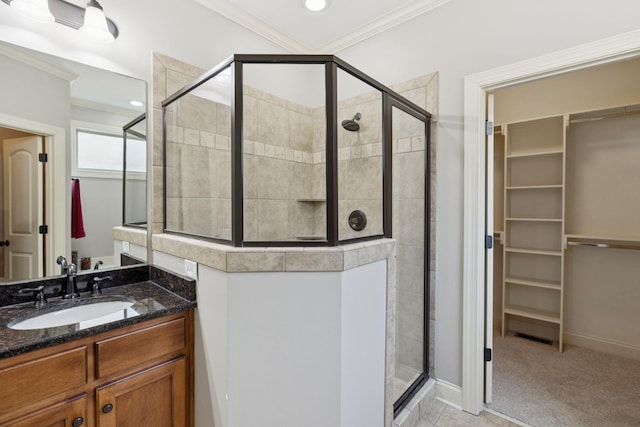 4181 Miles Johnson Pkwy, Spring Hill, TN 37174 - bathroom with a walk in closet, a stall shower, crown molding, vanity, and recessed lighting