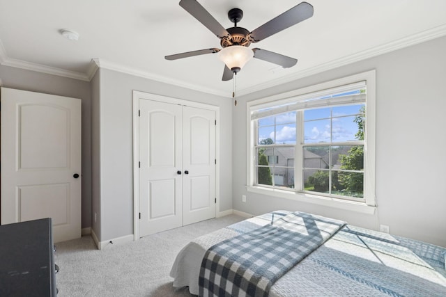 4181 Miles Johnson Pkwy, Spring Hill, TN 37174 - bedroom featuring light carpet, a closet, baseboards, ornamental molding, and a ceiling fan