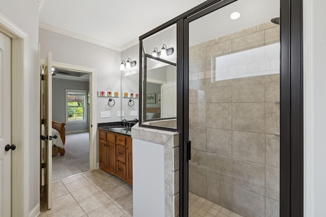 4181 Miles Johnson Pkwy, Spring Hill, TN 37174 - full bath with vanity, a shower stall, ornamental molding, connected bathroom, and tile patterned flooring