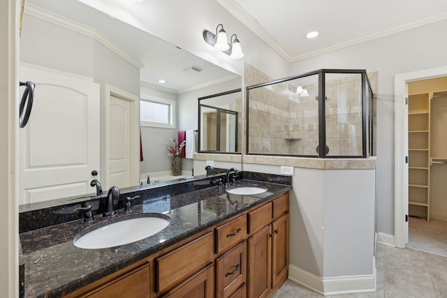 4181 Miles Johnson Pkwy, Spring Hill, TN 37174 - bathroom featuring a stall shower, double vanity, a walk in closet, ornamental molding, and tile patterned floors