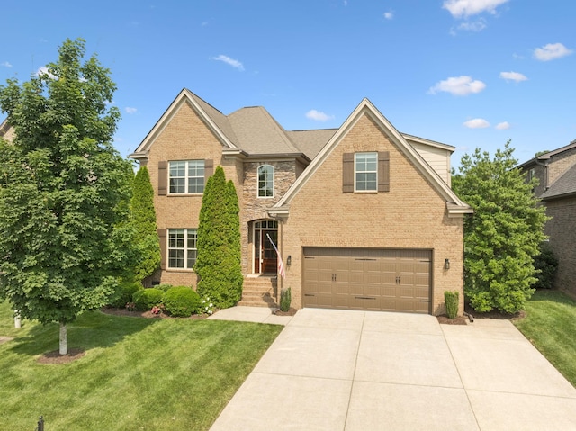 4181 Miles Johnson Pkwy, Spring Hill, TN 37174 - traditional-style home with brick siding, a garage, driveway, and a front lawn