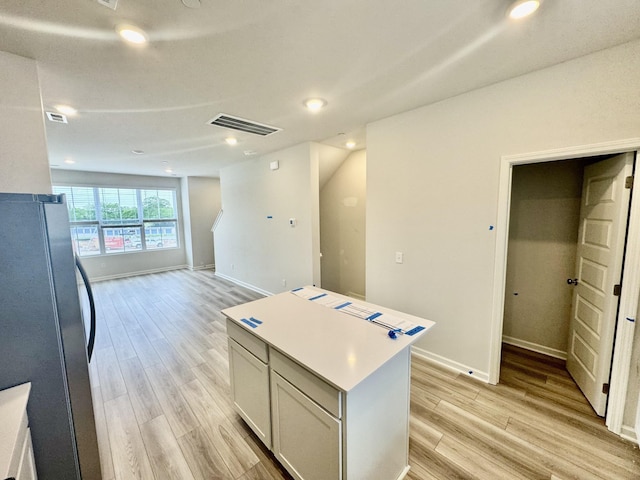 1103 Harper Lndg, Chapel Hill, TN 37034 - kitchen with freestanding refrigerator, light wood-style flooring, a center island, baseboards, and recessed lighting
