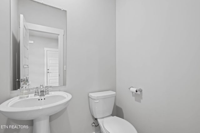 324 Gulfstream Dr, Gallatin, TN 37066 - half bath with toilet, a sink, and baseboards