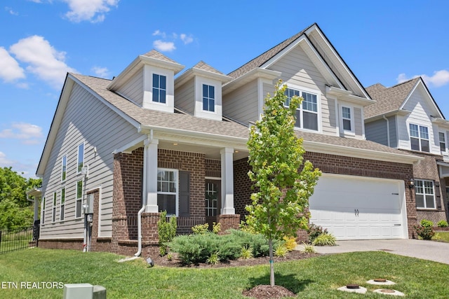 324 Gulfstream Dr, Gallatin, TN 37066 - craftsman house featuring concrete driveway, a garage, a porch, brick siding, and a shingled roof