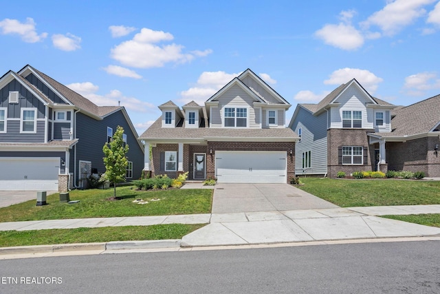 324 Gulfstream Dr, Gallatin, TN 37066 - craftsman house with brick siding, a garage, driveway, and a front lawn