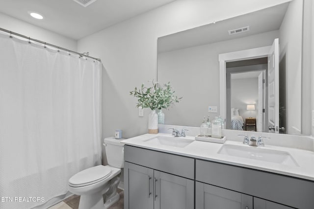 324 Gulfstream Dr, Gallatin, TN 37066 - full bath with double vanity, ensuite bathroom, toilet, and recessed lighting