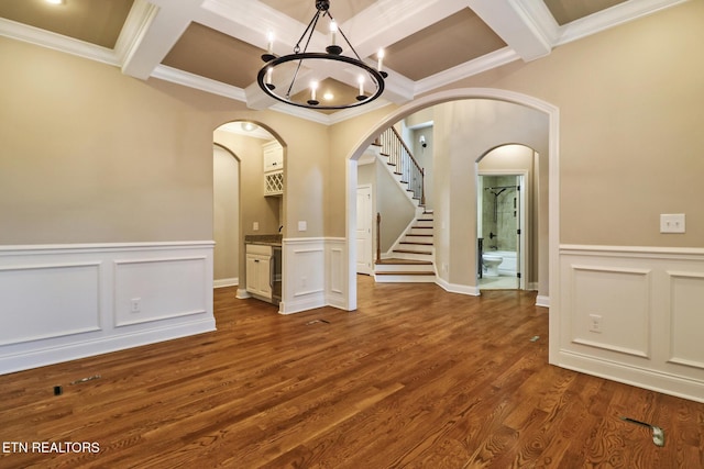 550 Stone Villa Ln, Knoxville, TN 37934 - spare room featuring coffered ceiling, arched walkways, a chandelier, ornamental molding, and beam ceiling