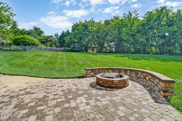 550 Stone Villa Ln, Knoxville, TN 37934 - view of patio / terrace featuring an outdoor fire pit, a trampoline, and view of scattered trees