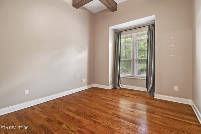 550 Stone Villa Ln, Knoxville, TN 37934 - empty room featuring wood finished floors, beam ceiling, and baseboards