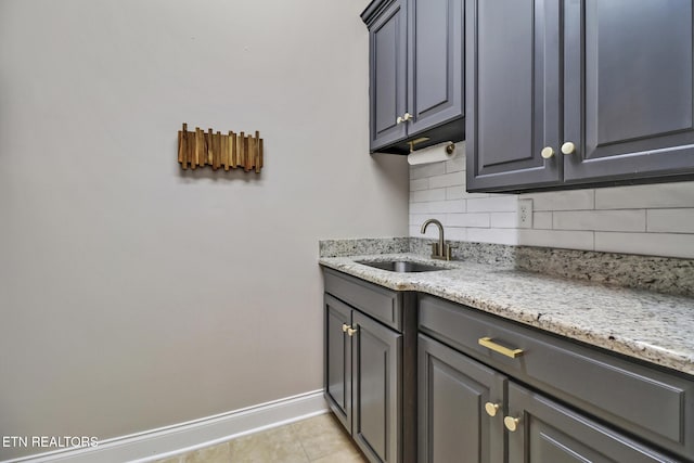 550 Stone Villa Ln, Knoxville, TN 37934 - kitchen with a sink, tasteful backsplash, baseboards, and light tile patterned floors