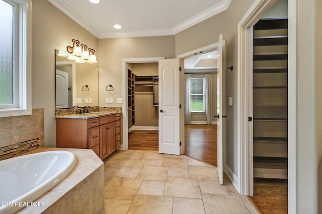550 Stone Villa Ln, Knoxville, TN 37934 - full bathroom featuring vanity, a walk in closet, plenty of natural light, ornamental molding, and a bath